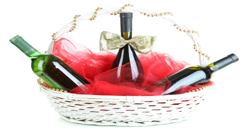 Gift basket with wine isolated on white